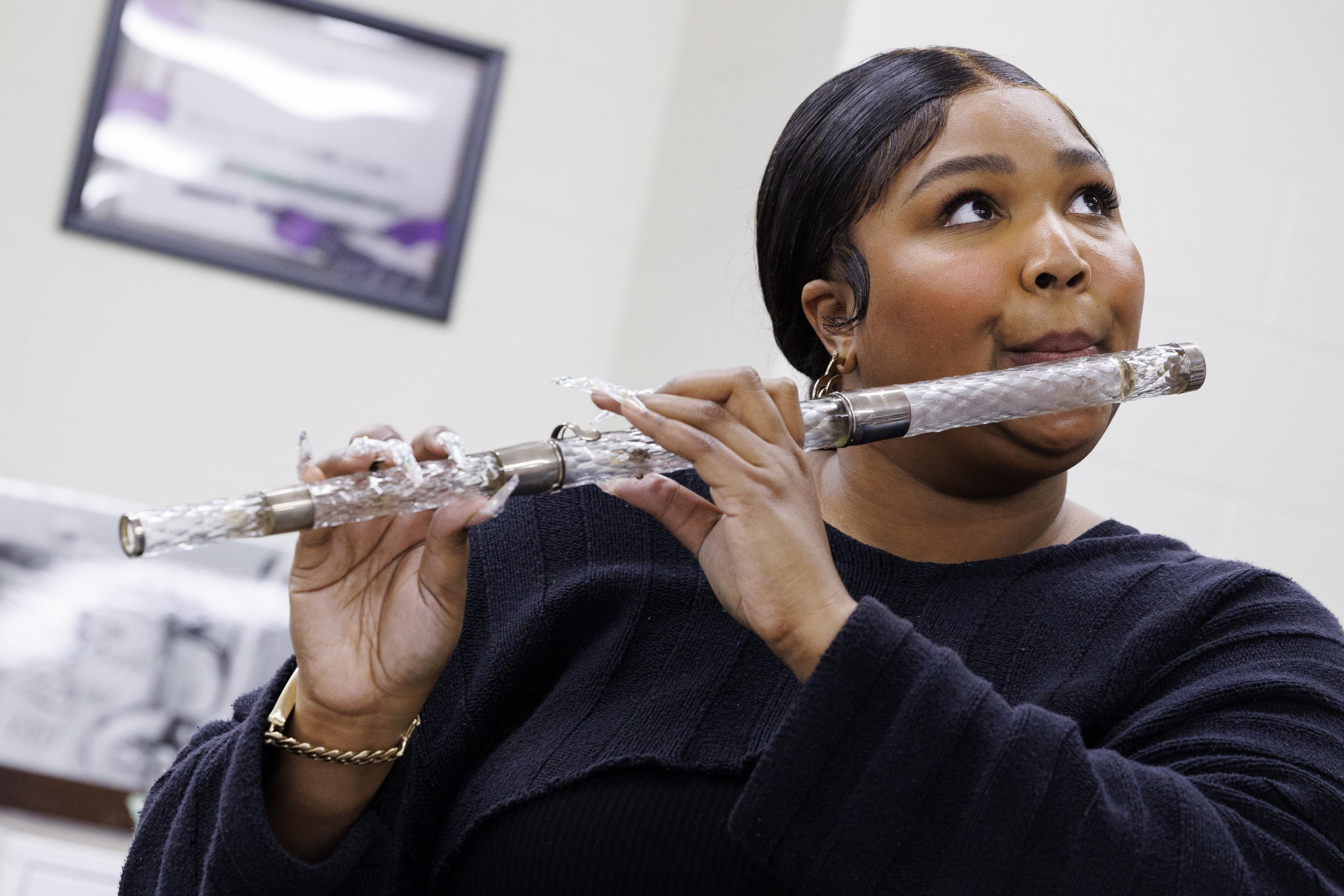 Lizzo plays President James Madison's crystal flute in the flute vault at the Library of Congress on Sept. 26, 2022. Photo by Shawn Miller